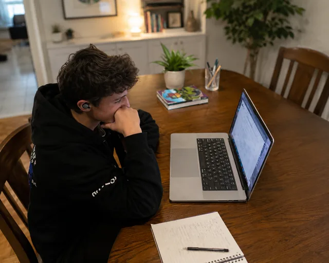 Dylan studying at his laptop
